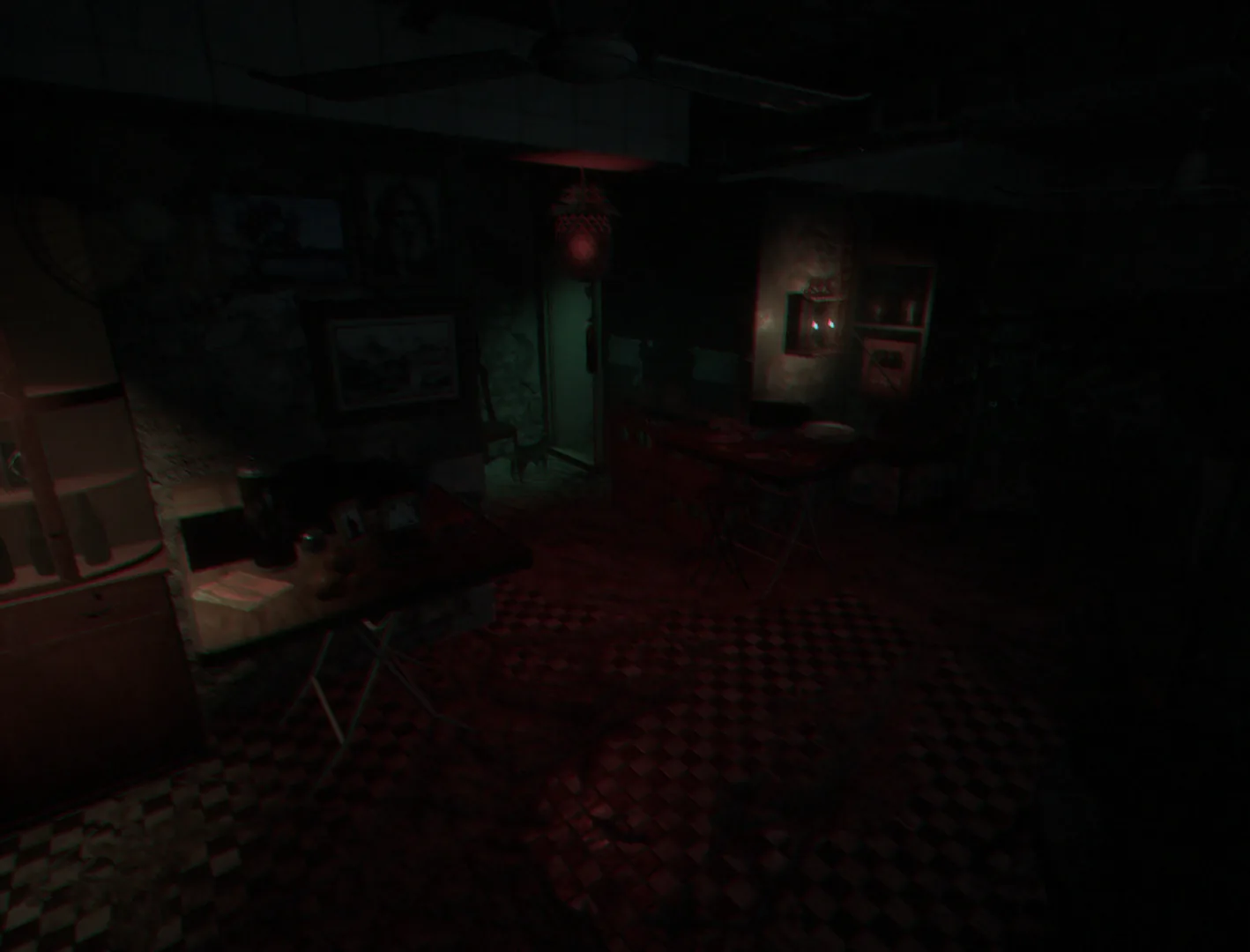 A dark apartment lit by a red lantern